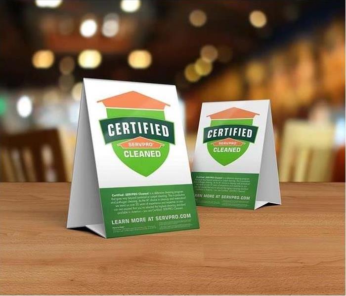 Table tent signs describing the Certified: SERVPRO Cleaned program