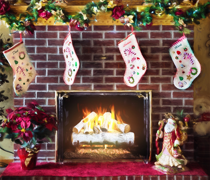 Lit up fireplace, with Christmas decorations and stockings hanging